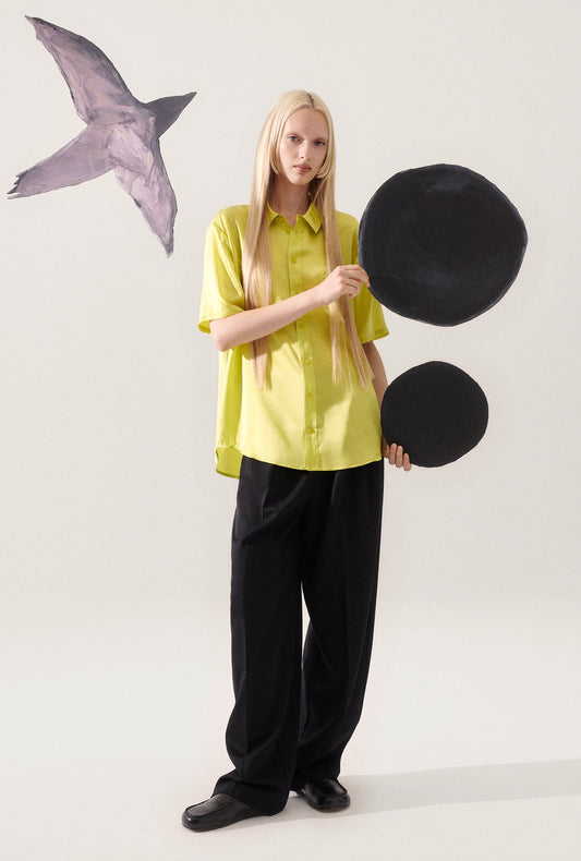 Image of a model wearing Tops. Productname: Short Sleeve Boyfriend Shirt Absinthe in Absinthe colour by brand - Silk Laundry