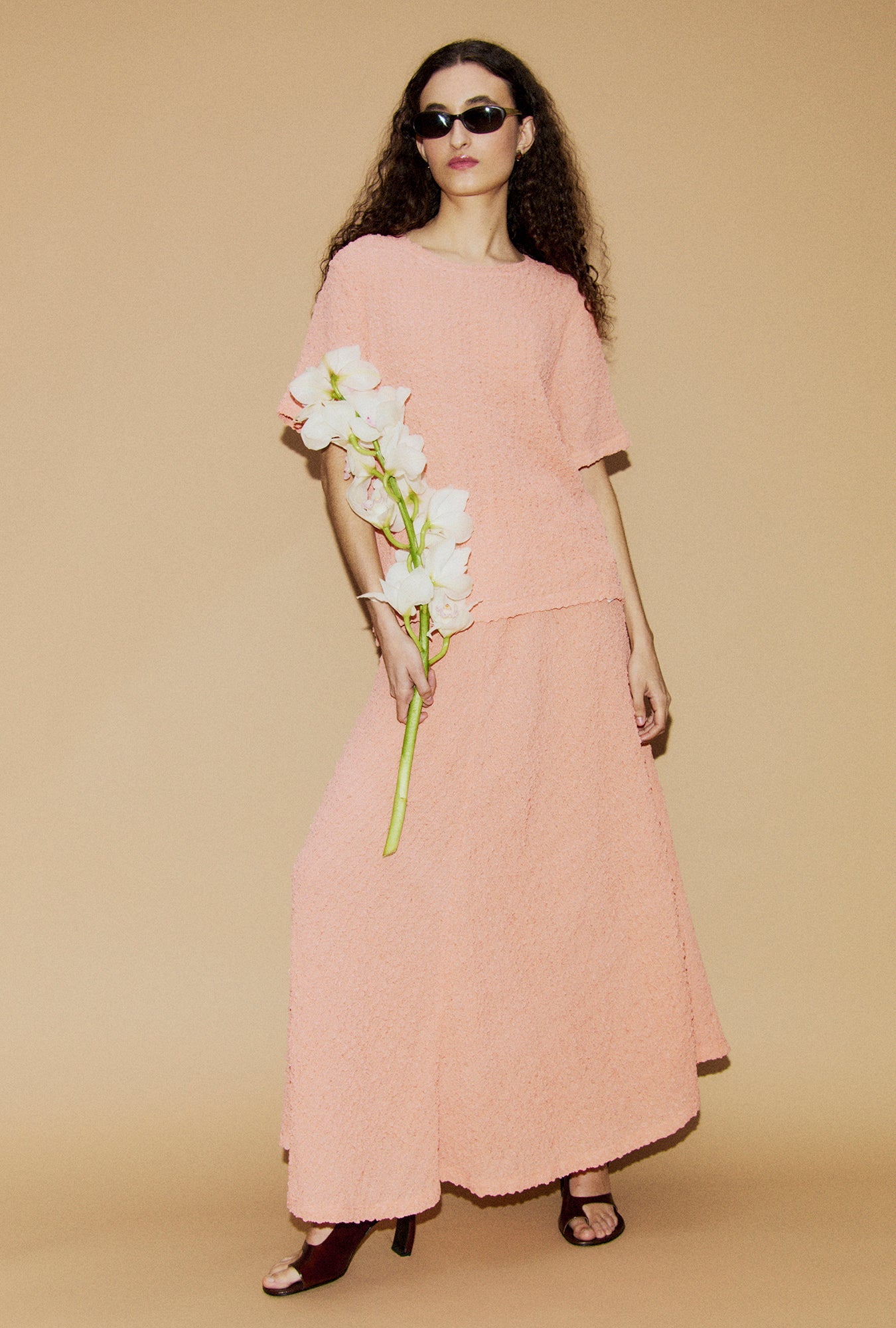 Image of a model wearing Skirts. Product name - Pebble Full Circle Skirt Orchid in Orchid colour by brand - Silk Laundry