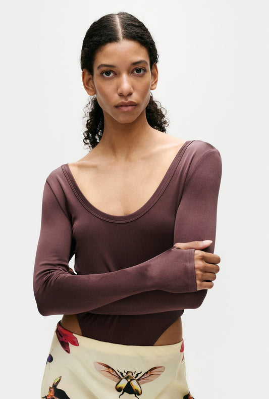 Image of a model wearing Tops. Product name - Jersey Modal Long Sleeve Cutaway Bodysuit Cacao in Cacao colour by brand - Silk Laundry