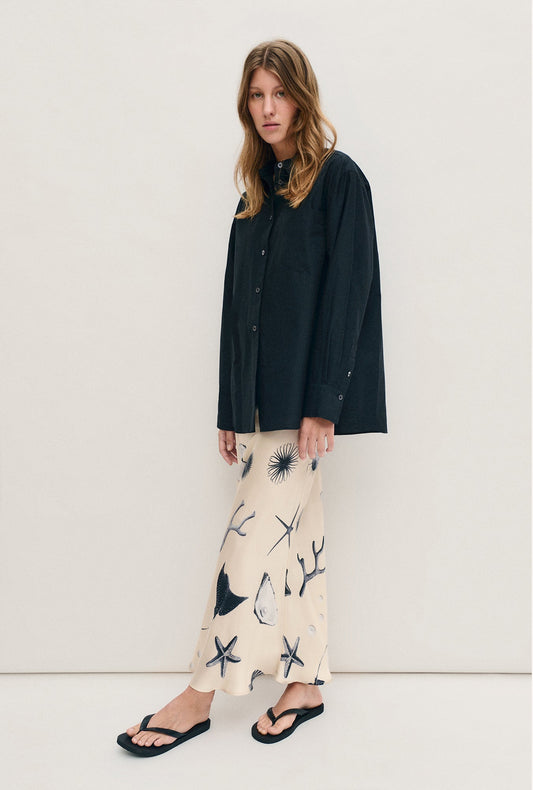 Image of a model wearing Skirts. Productname: Silk Laundry Long Bias Cut Skirt in Seashells colour by brand - Silk Laundry