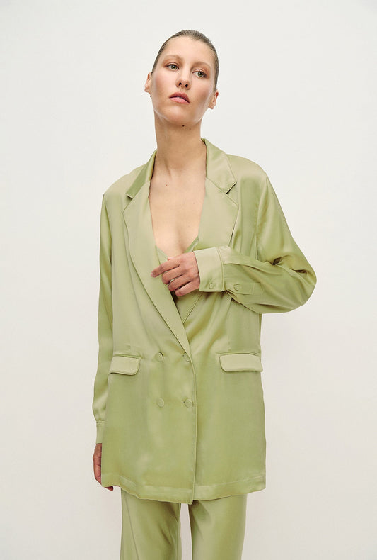 Image of a model wearing Outerwear. Productname: Relaxed Blazer Sage in Sage colour by brand - Silk Laundry