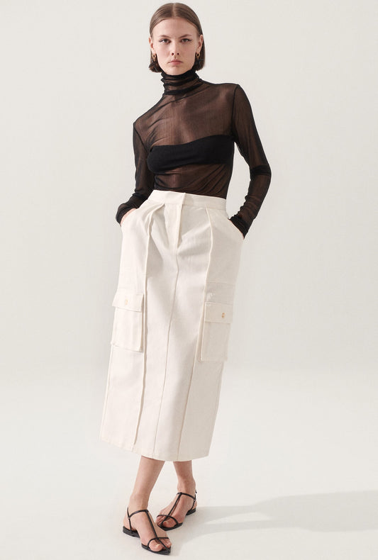 Image of a model wearing Skirts. Product name - Canvas Cargo Skirt Natural in Natural colour by brand - Silk Laundry