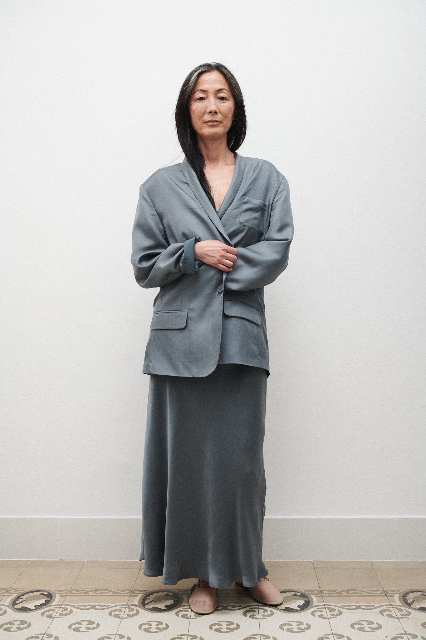 Image of a model wearing Outerwear. Product name - Twill Miami Blazer Slate in Slate colour by brand - Silk Laundry