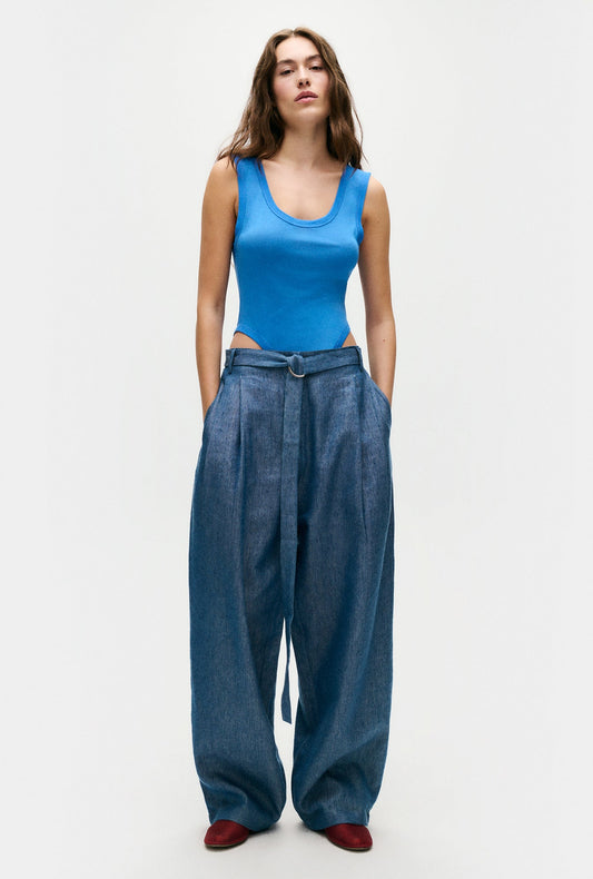 Image of a model wearing Tops. Productname: Silk Laundry Cutaway Bodysuit in Wave colour by brand - Silk Laundry