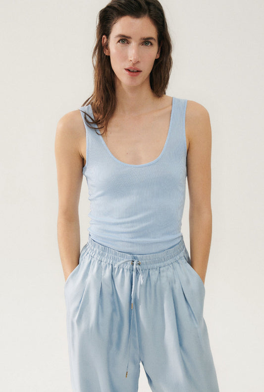 Image of a model wearing Tops. Productname: Ribbed Tank Sky in Sky colour by brand - Silk Laundry