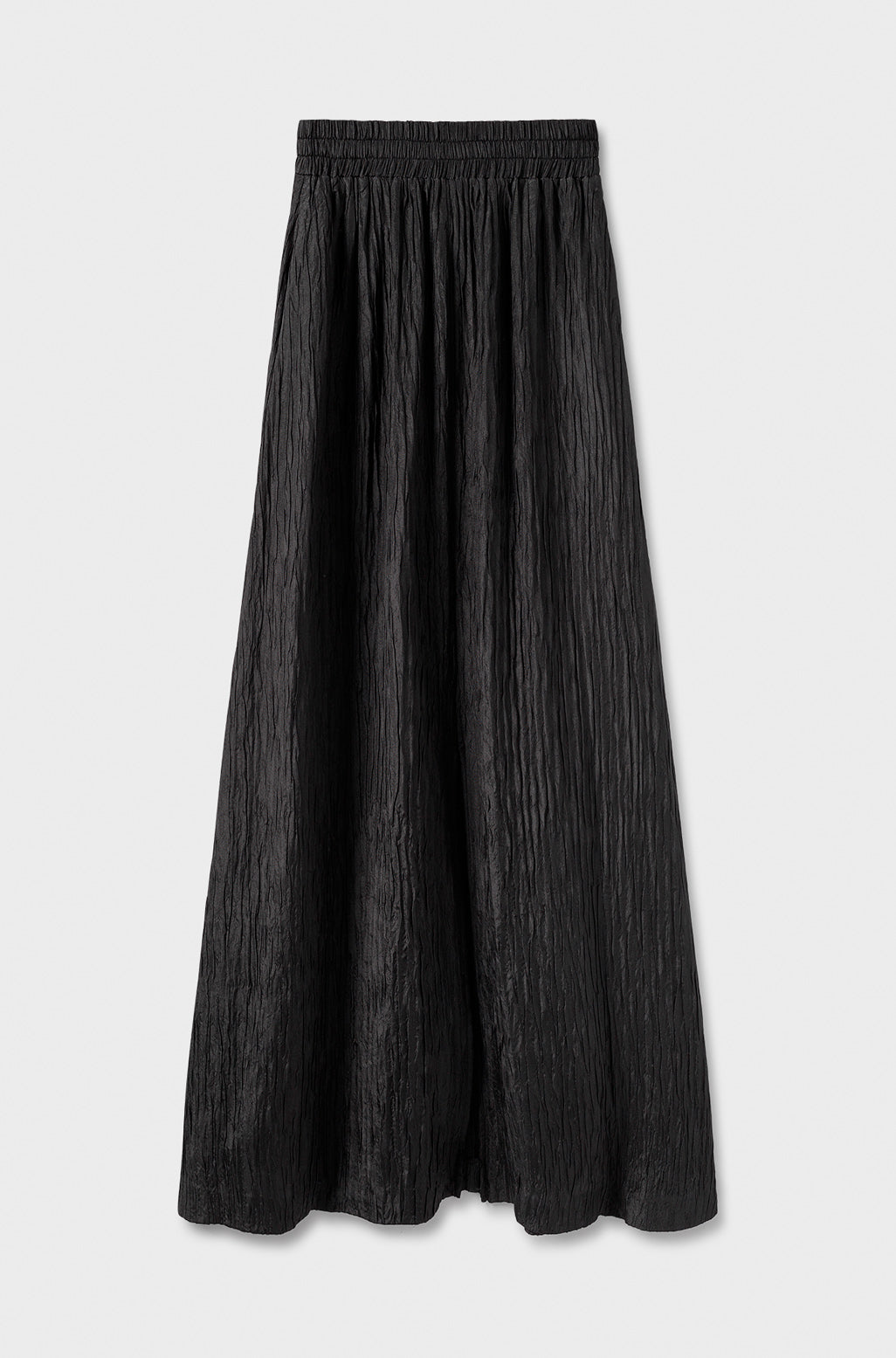 Image of a model wearing Skirts. Product name - Crinkle Skirt Black in Black colour by brand - Silk Laundry