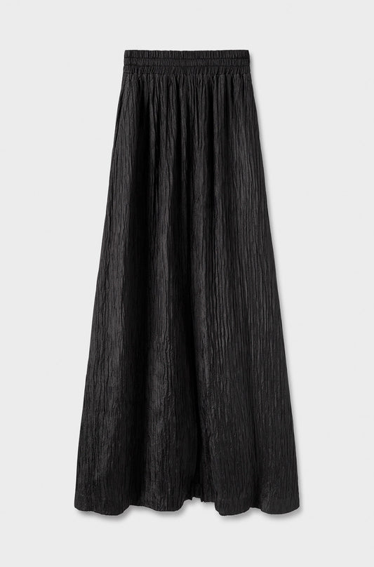 Image of a model wearing Skirts. Product name - Crinkle Skirt Black in Black colour by brand - Silk Laundry