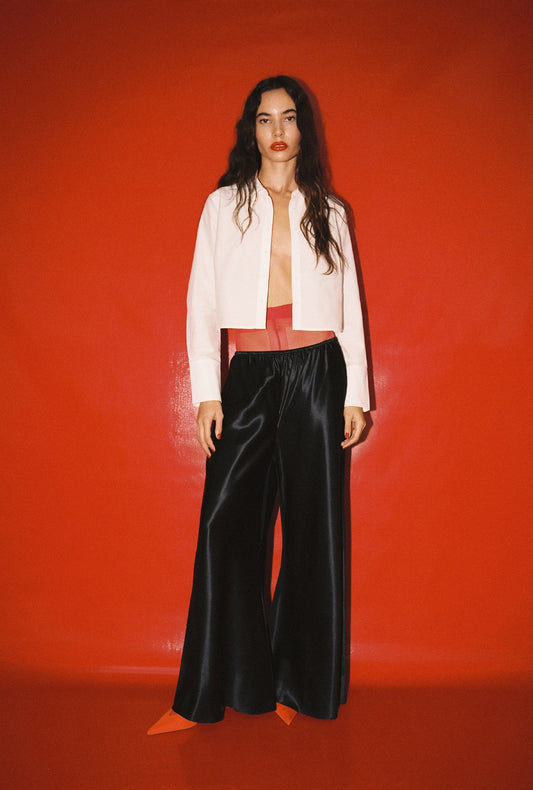 Image of a model wearing Pants. Productname: Wide Bias Pants Raw Edge Black in Black colour by brand - Silk Laundry