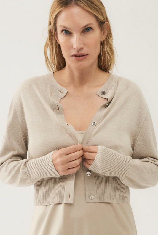 Image of a model wearing Outerwear. Productname: Cropped Cardigan Hazelnut in Hazelnut colour by brand - Silk Laundry