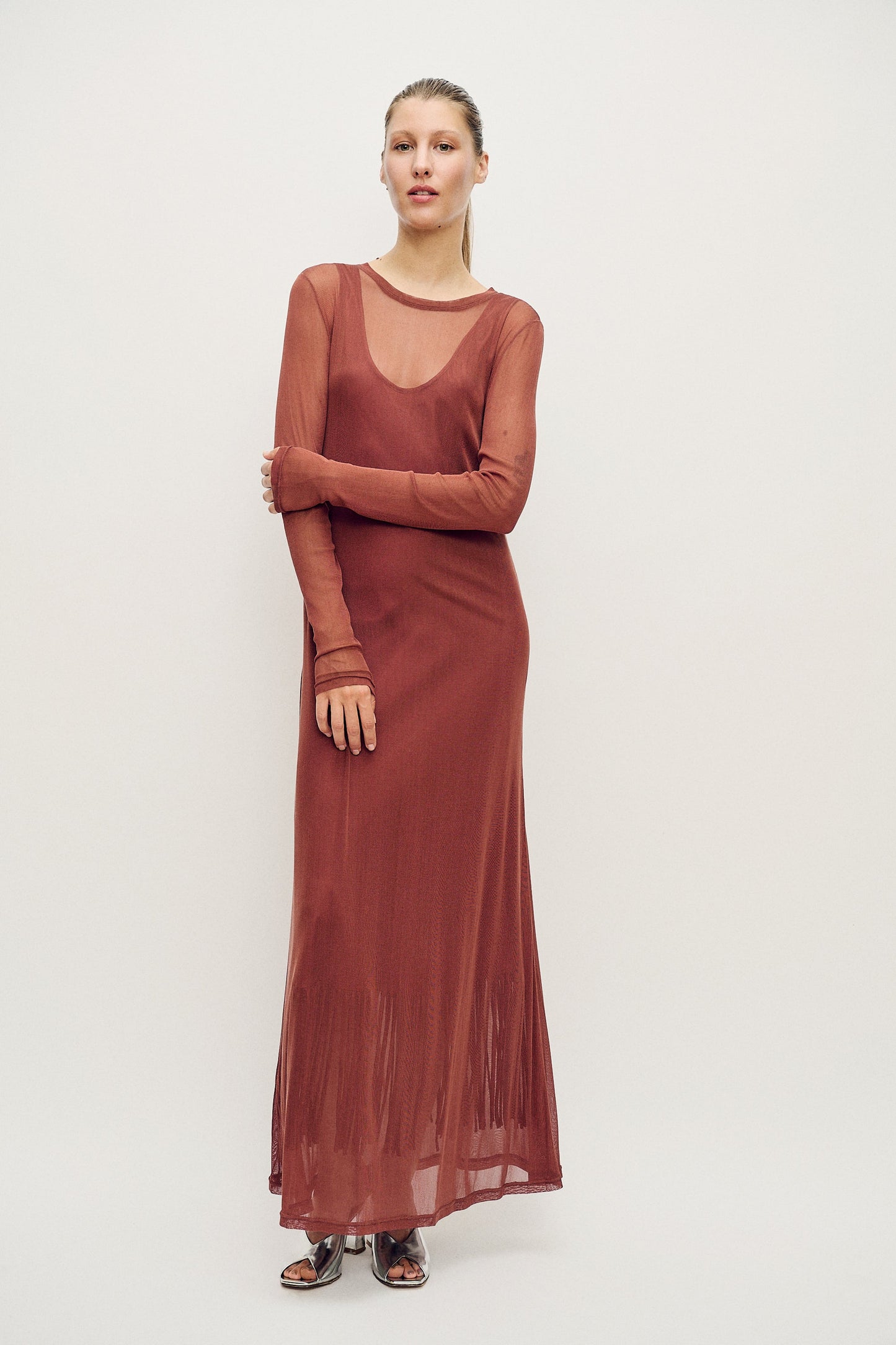 Image of a model wearing Tops. Product name - Mesh Long Sleeve Dress Canyon in Canyon colour by brand - Silk Laundry