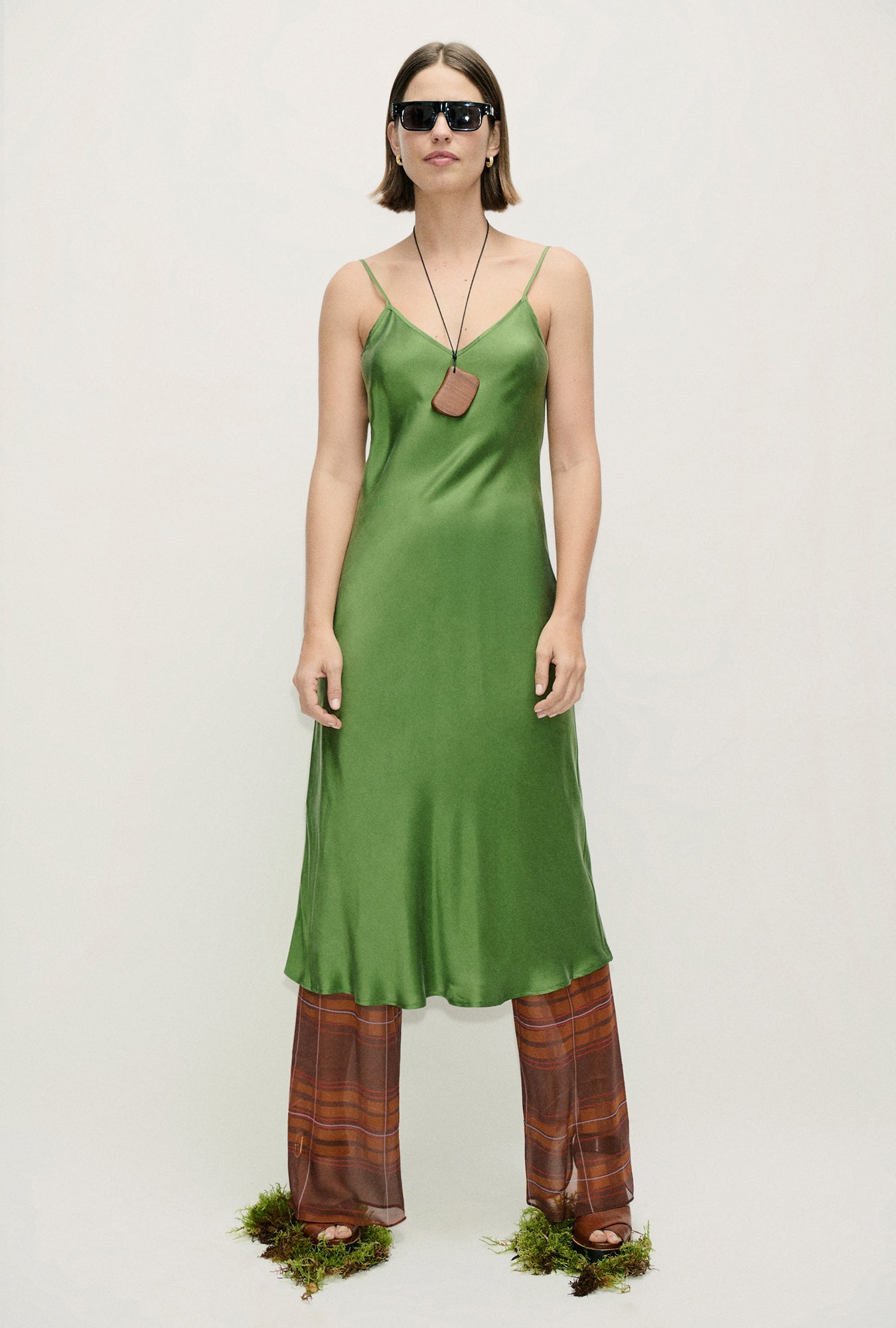 Image of a model wearing Pants. Product name - Chiffon Bias Cut Pants Root Plaid in Root Plaid colour by brand - Silk Laundry