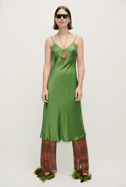 Image of a model wearing Pants. Product name - Chiffon Bias Cut Pants Root Plaid in Root Plaid colour by brand - Silk Laundry