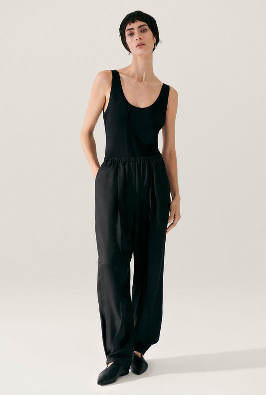Image of a model wearing Pants. Productname: Silk Laundry Twill Harem Pants Black in Black colour by brand - Silk Laundry