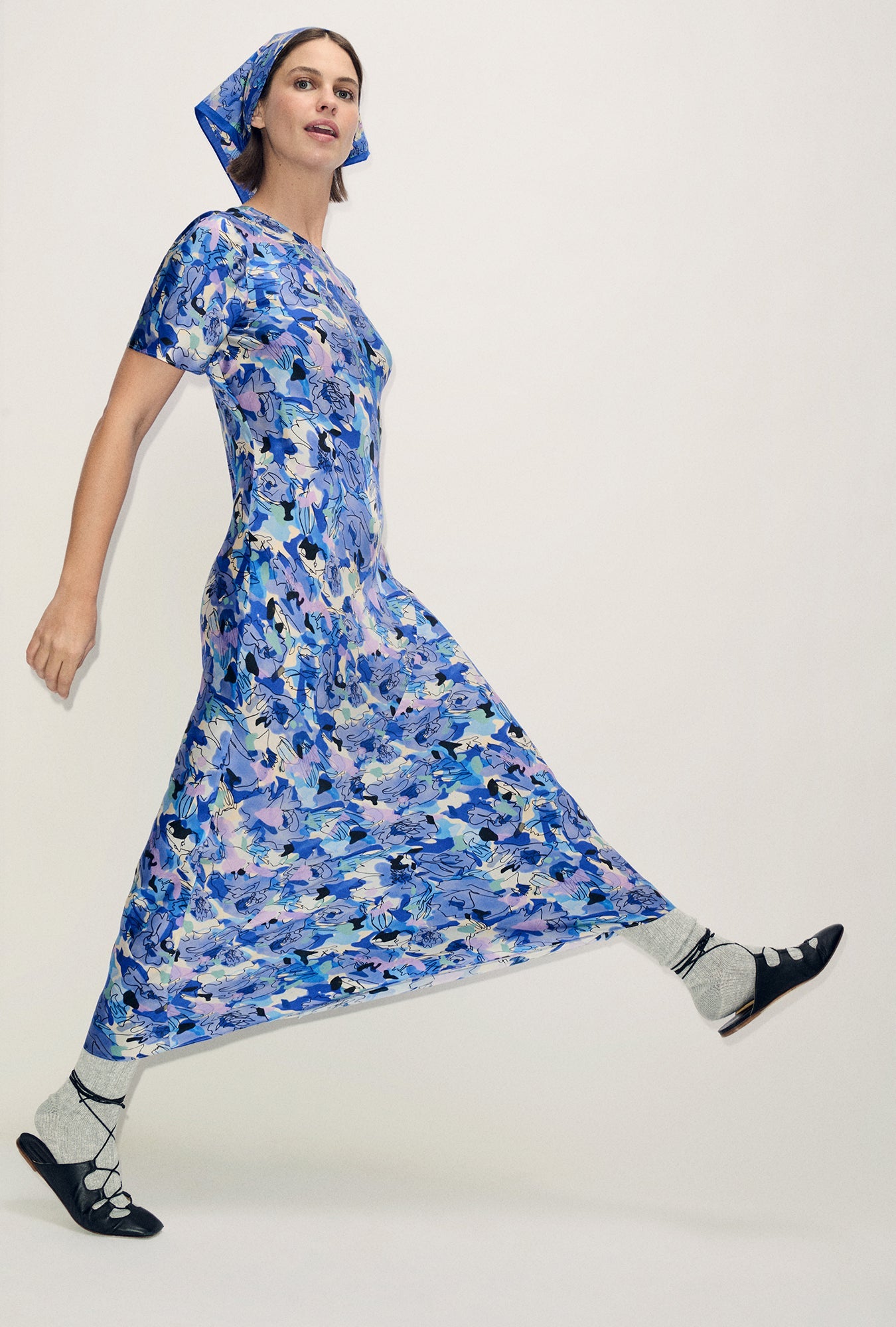 Image of a model wearing Tops. Product name - Short Sleeve Bias Dress Cornflower Floral in Cornflower Floral colour by brand - Silk Laundry