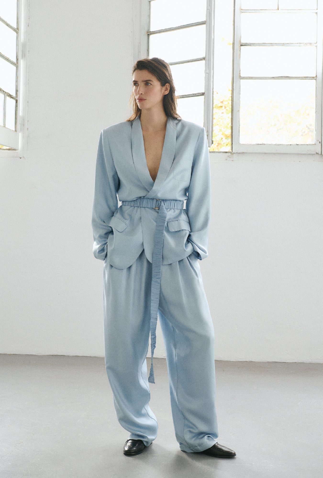 Image of a model wearing Outerwear. Product name - Twill Miami Blazer Sky in Sky colour by brand - Silk Laundry
