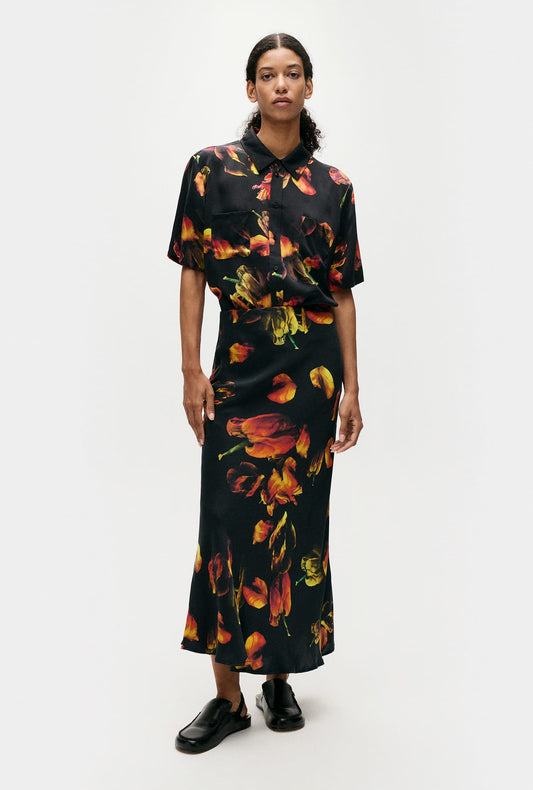 Image of a model wearing Skirts. Product name - Long Bias Cut Skirt Tulipa Black in Tulipa Black colour by brand - Silk Laundry