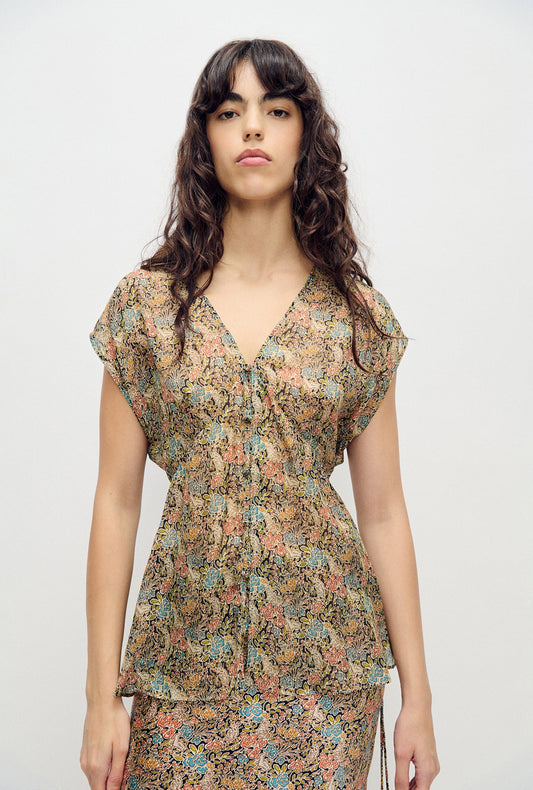 Image of a model wearing Tops. Product name - Chiffon V-Neck Top Sugar Floral in Sugar Floral colour by brand - Silk Laundry