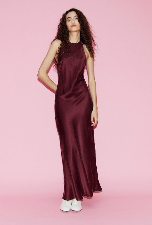 Image of a model wearing Tops. Product name - Long Halter Dress Deadleaf in Deadleaf colour by brand - Silk Laundry