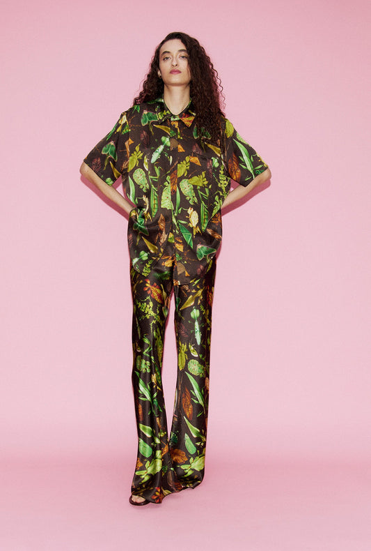 Image of a model wearing Tops. Product name - Short Sleeve Boyfriend Shirt Bug Camo in Bug Camo colour by brand - Silk Laundry