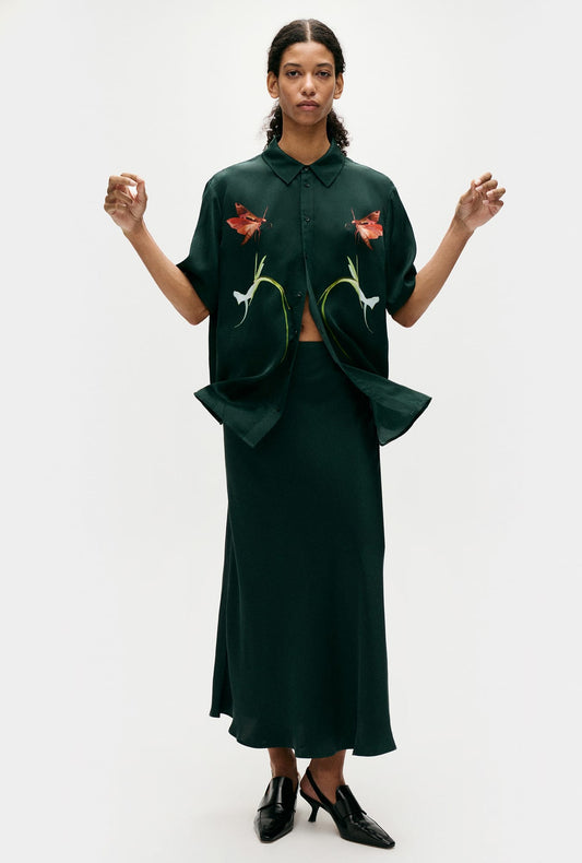 Image of a model wearing Skirts. Productname: Silk Laundry Long Bias Cut Skirt Scarab in Scarab colour by brand - Silk Laundry