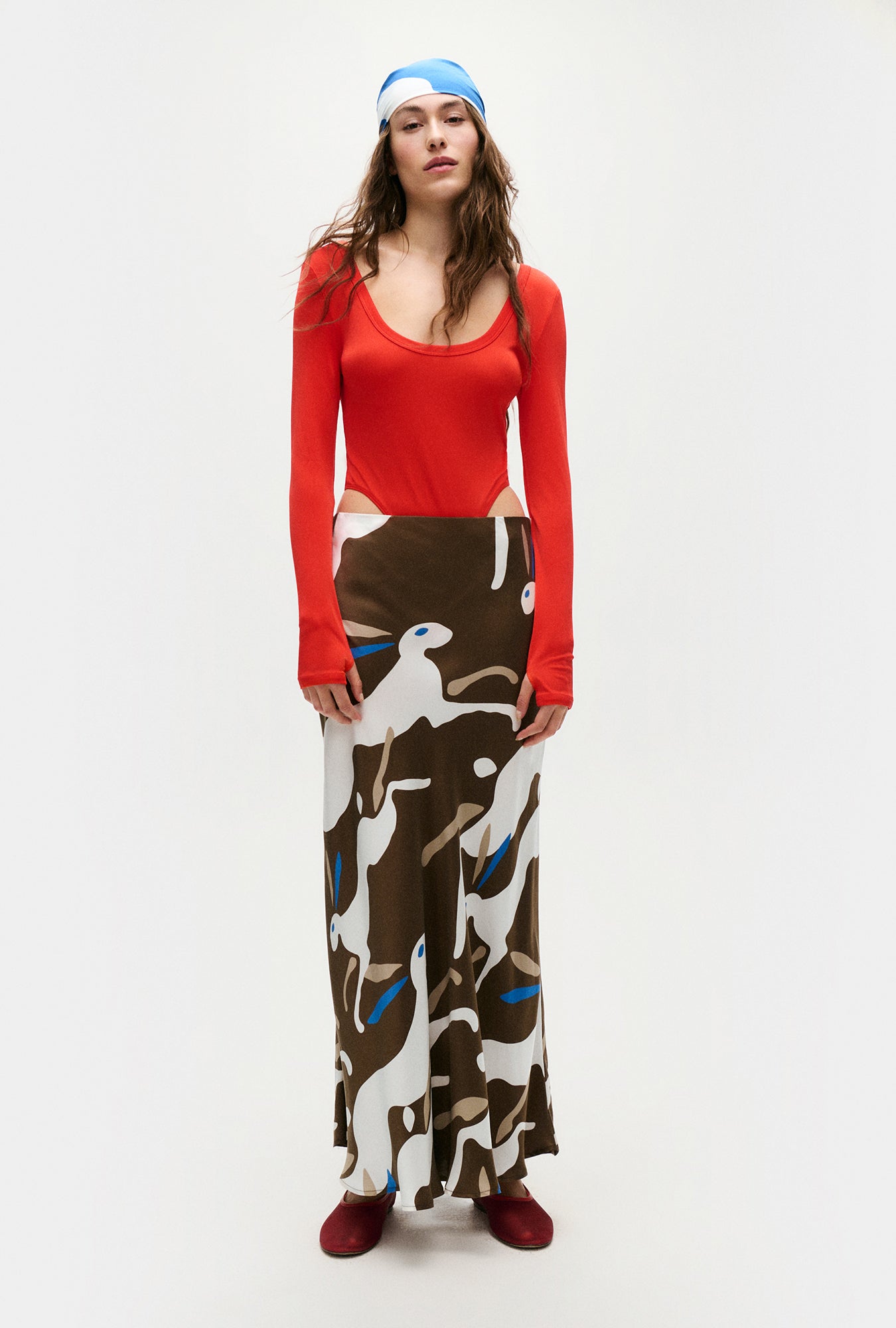 Image of a model wearing Skirts. Product name - Long Bias Cut Skirt Rabbit Dark Earth in Rabbit Dark Earth colour by brand - Silk Laundry