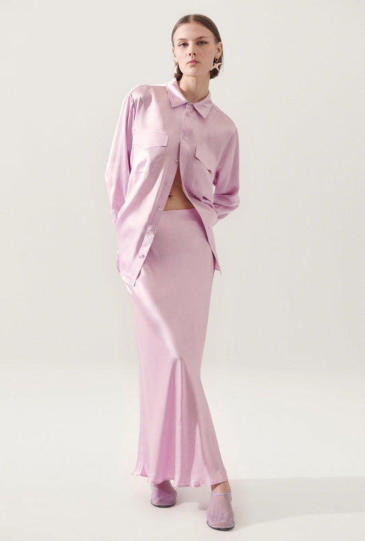 Image of a model wearing Skirts. Productname: Long Bias Cut Skirt Lilac in Lilac colour by brand - Silk Laundry