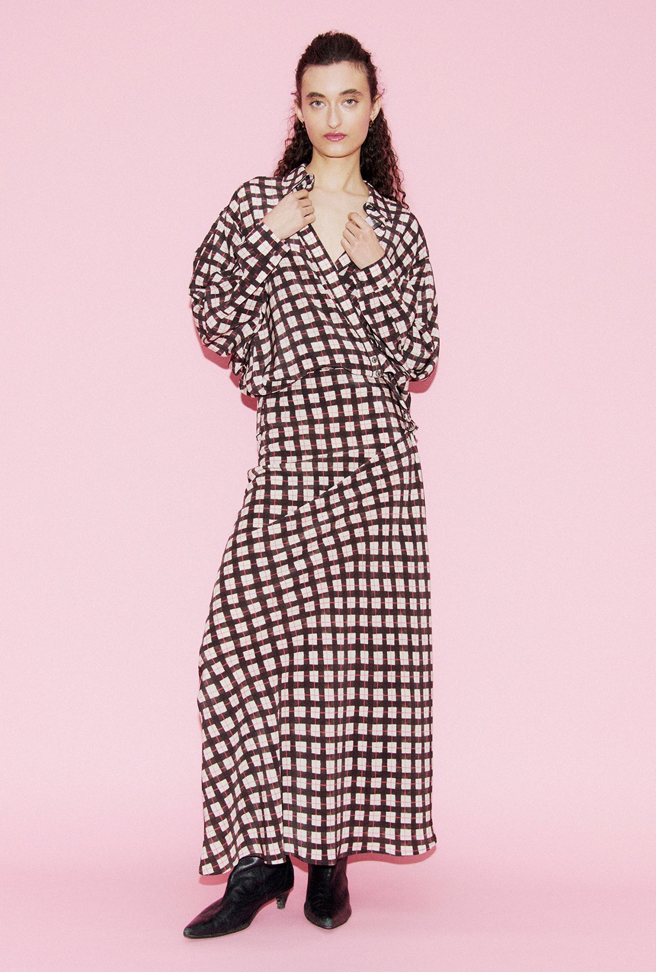 Image of a model wearing Skirts. Product name - CDC Long Bias Cut Skirt Luna Gingham in Luna Gingham colour by brand - Silk Laundry