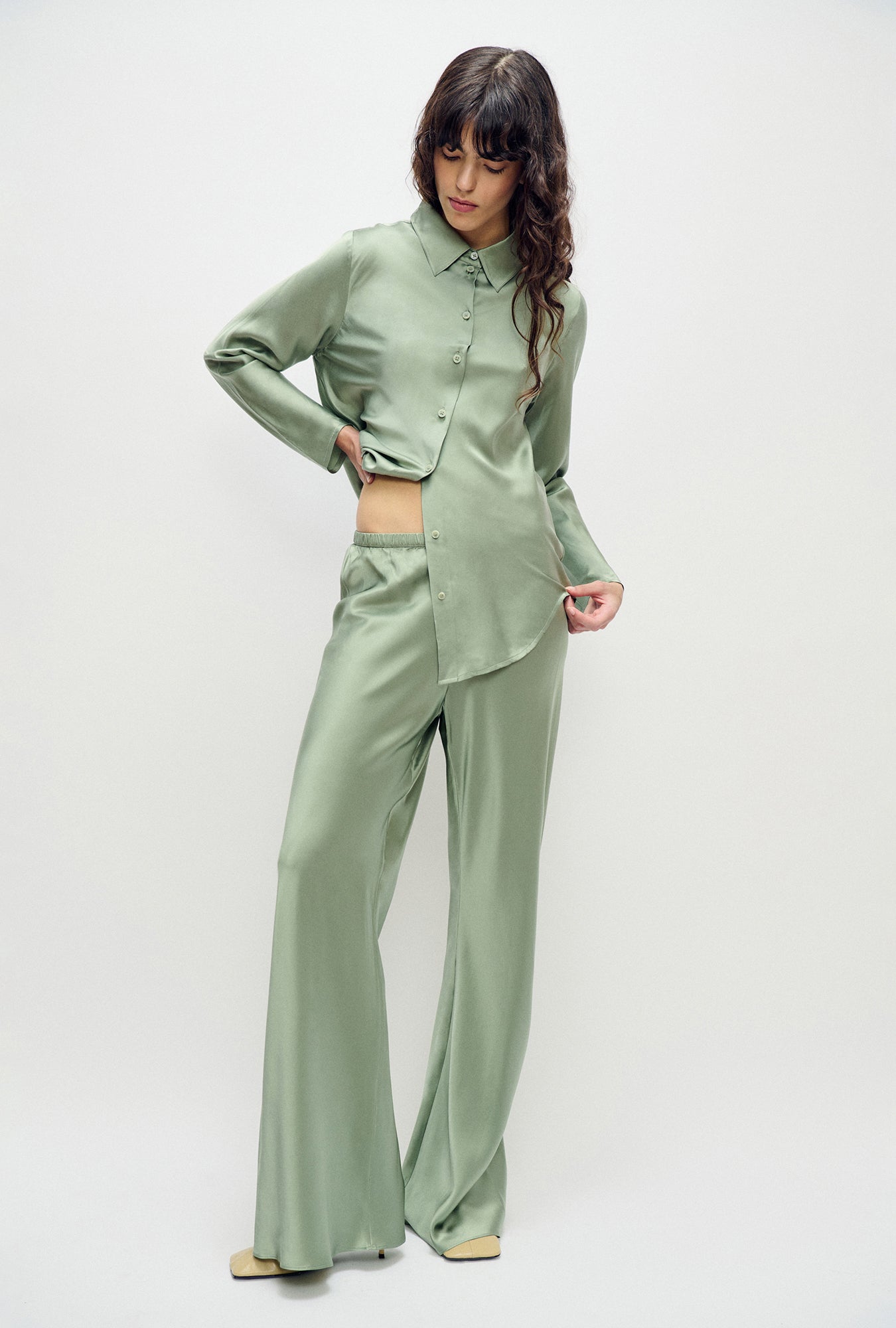 Image of a model wearing Pants. Product name - Bias Cut Pants Moonshine in Moonshine colour by brand - Silk Laundry