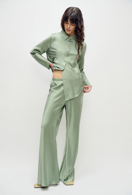 Image of a model wearing Pants. Product name - Bias Cut Pants Moonshine in Moonshine colour by brand - Silk Laundry