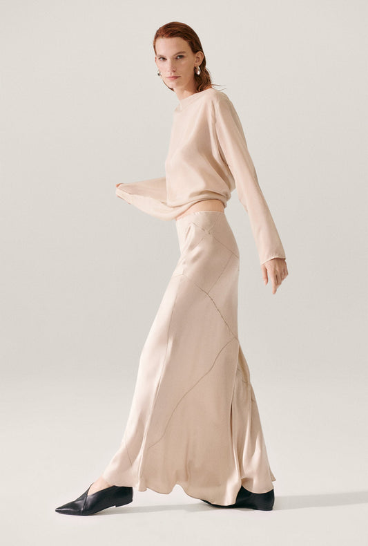 Image of a model wearing Skirts. Productname: Splice Long Bias Cut Skirt Hazelnut in Hazelnut colour by brand - Silk Laundry