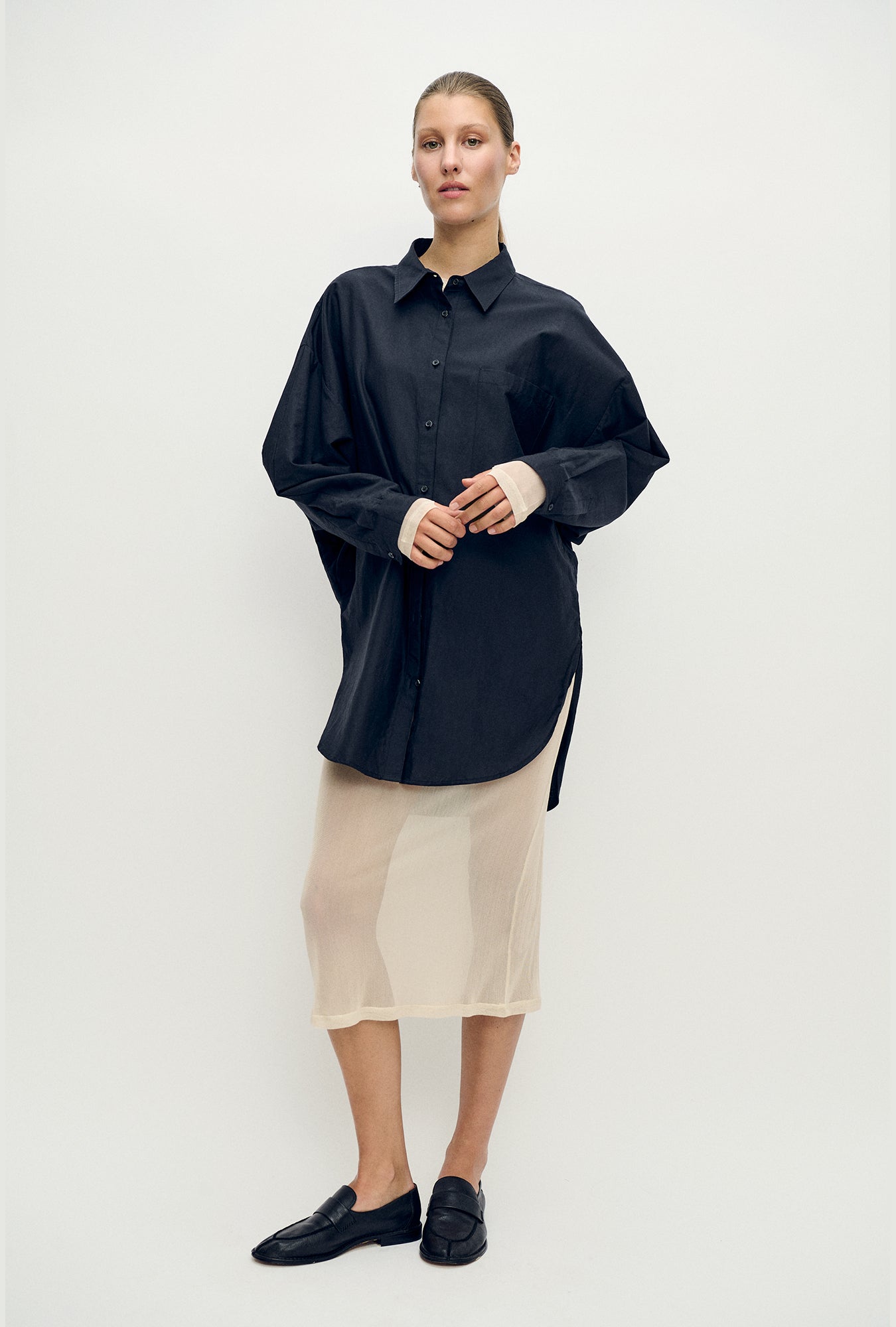 Image of a model wearing Skirts. Product name - Mesh Skirt Hazelnut in Hazelnut colour by brand - Silk Laundry
