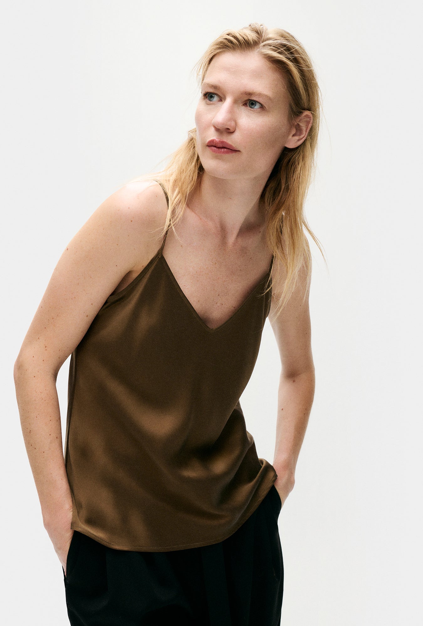 Image of a model wearing Tops. Product name - Bias Cut Cami Dark Earth in Dark Earth colour by brand - Silk Laundry