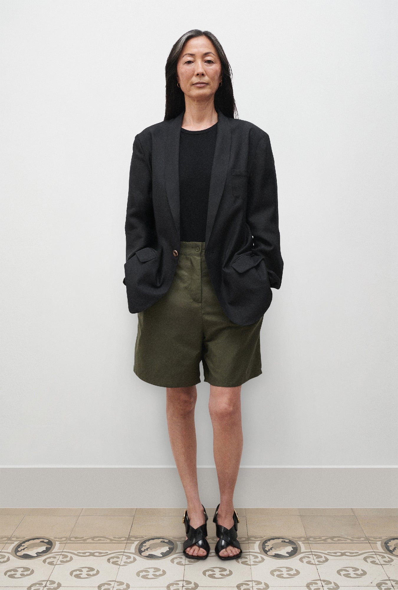 Image of a model wearing Outerwear. Product name - Twill Miami Blazer Black in Black colour by brand - Silk Laundry