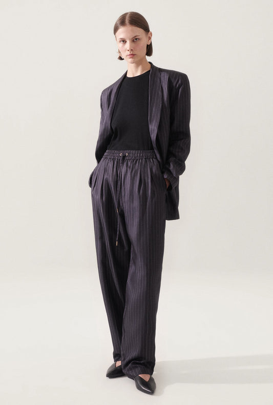 Image of a model wearing Outerwear. Productname: Silk Laundry Twill Miami Blazer Pinstripe Black / White in Pinstripe Black/White colour by brand - Silk Laundry