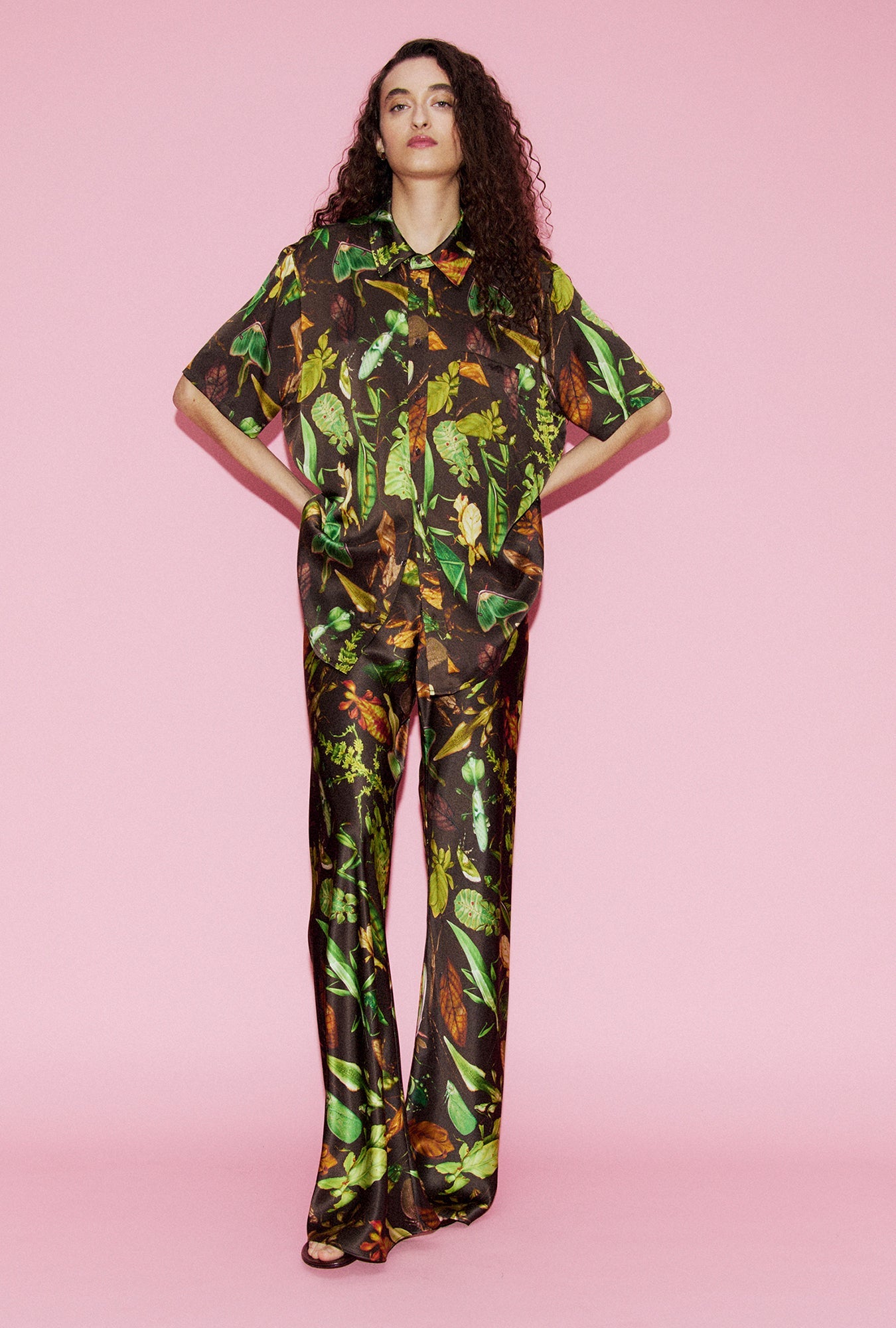 Image of a model wearing Pants. Product name - Bias Cut Pants Bug Camo in Bug Camo colour by brand - Silk Laundry