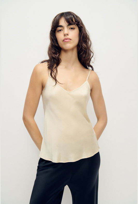 Image of a model wearing Tops. Product name - Bias Cut Cami Hazelnut in Hazelnut colour by brand - Silk Laundry