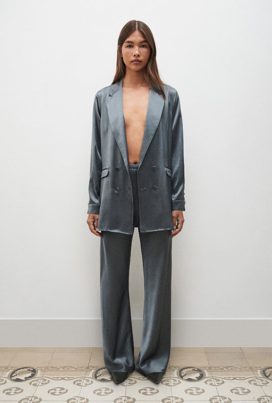 Image of a model wearing Pants. Product name - Bias Cut Pants Slate in Slate colour by brand - Silk Laundry