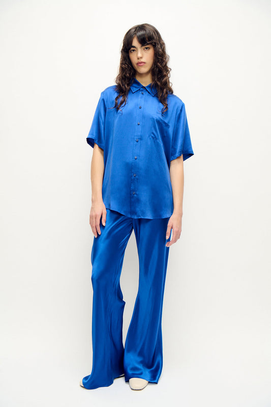 Image of a model wearing Tops. Product name - Short Sleeve Boyfriend Shirt Wedgwood in Wedgwood colour by brand - Silk Laundry