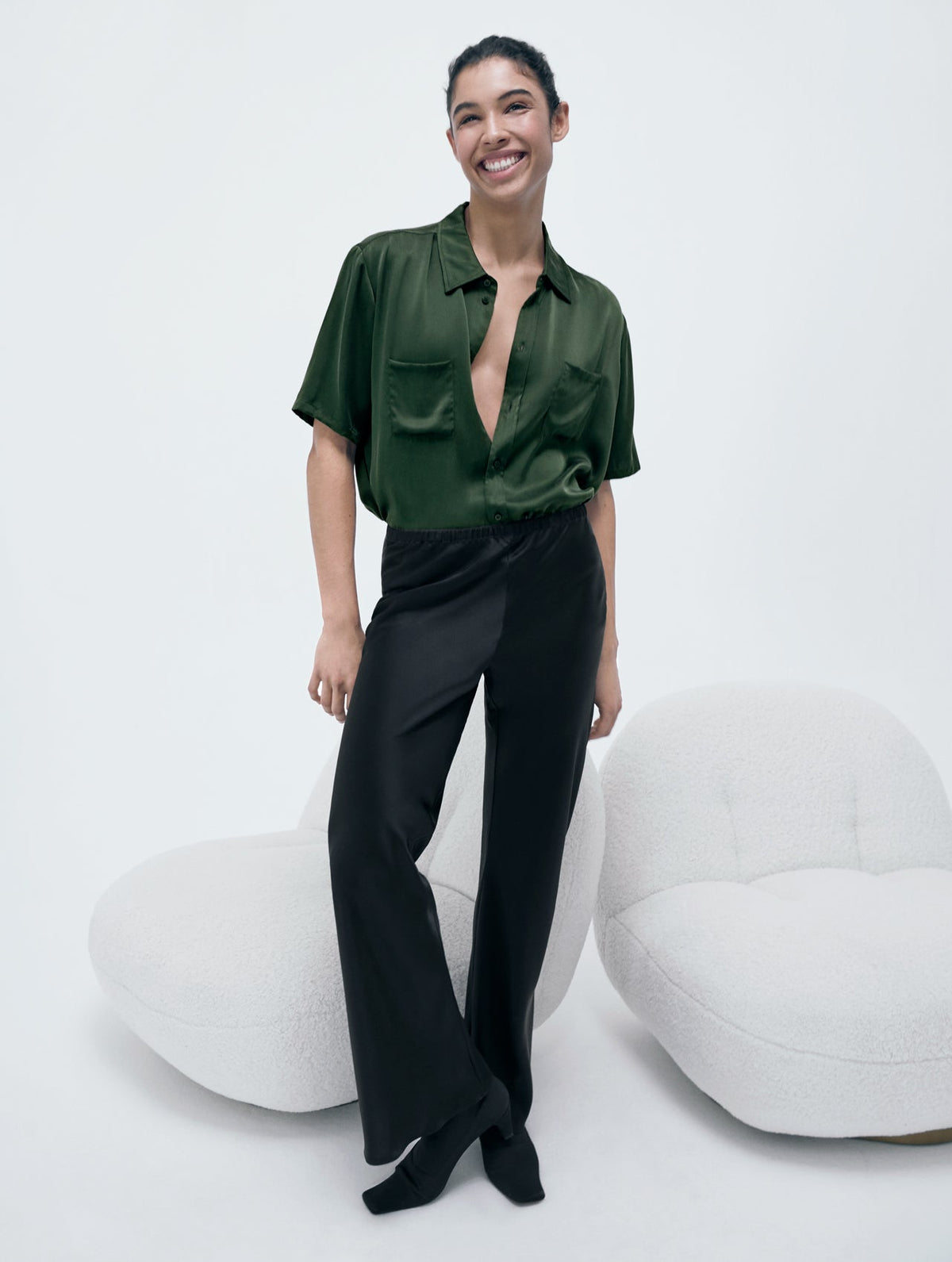 Image of a model wearing Tops. Product name - Short Sleeve Boyfriend Shirt Cedar in Cedar colour by brand - Silk Laundry