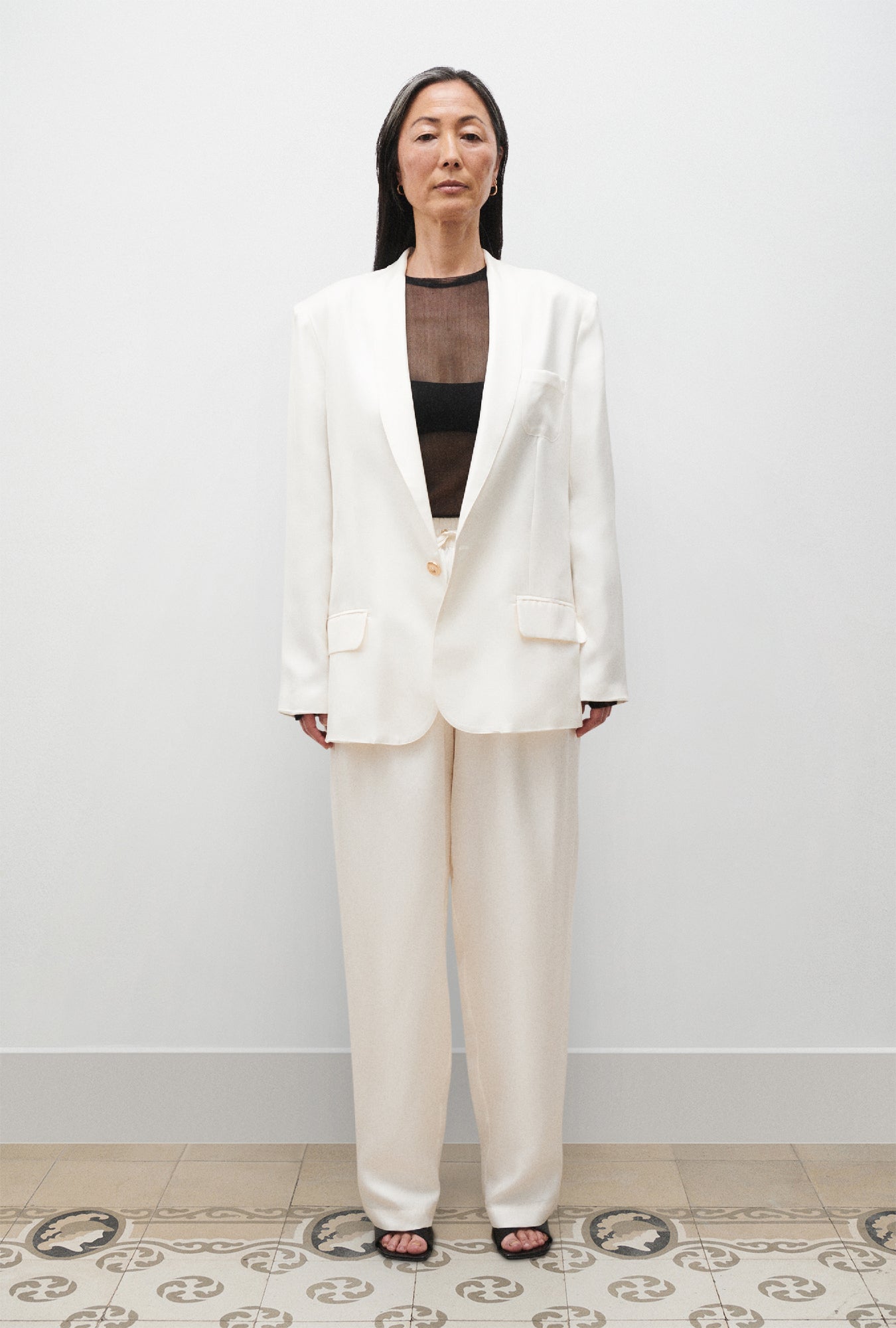 Image of a model wearing Outerwear. Product name - Twill Miami Blazer White in White colour by brand - Silk Laundry