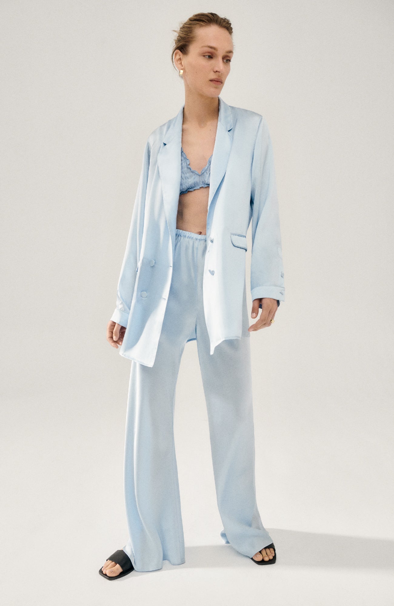 Image of a model wearing Outerwear. Product name - Relaxed Blazer Sky in Sky colour by brand - Silk Laundry
