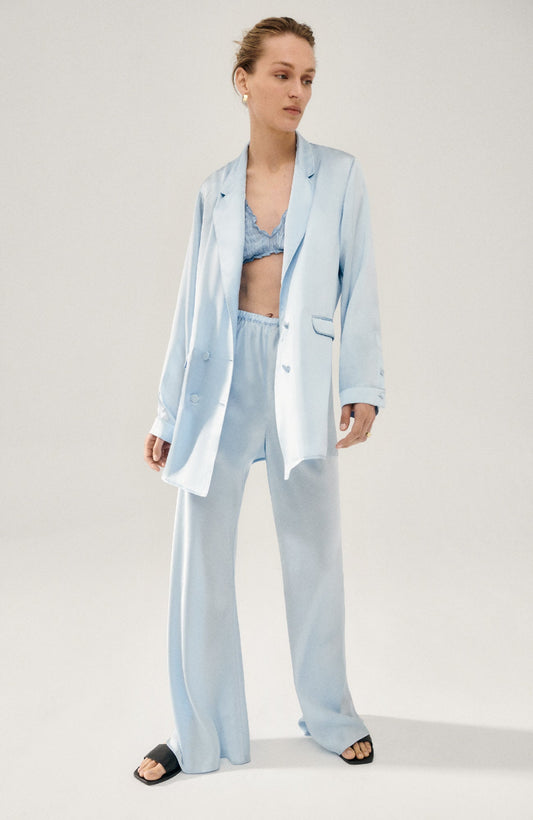 Image of a model wearing Outerwear. Product name - Relaxed Blazer Sky in Sky colour by brand - Silk Laundry