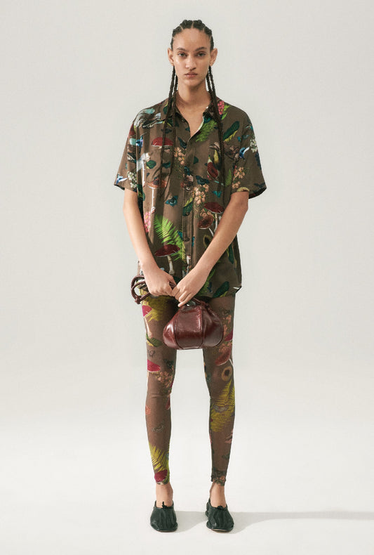 Image of a model wearing Pants. Product name - Mesh Leggings Magic Mushroom Dark Earth in Magic Mushroom Dark Earth colour by brand - Silk Laundry