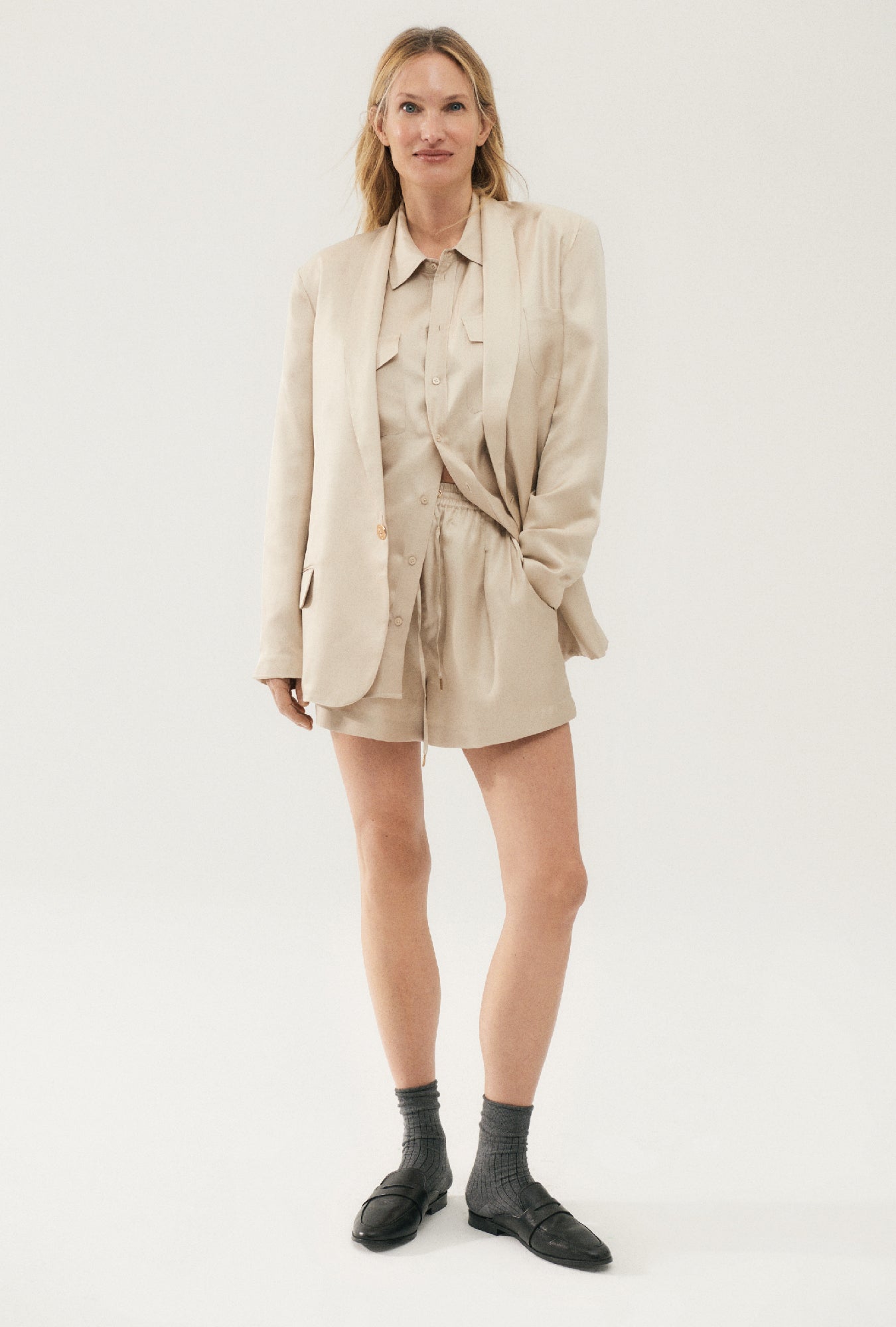 Image of a model wearing Shorts. Product name - Twill Slouch Shorts Hazelnut in Hazelnut colour by brand - Silk Laundry