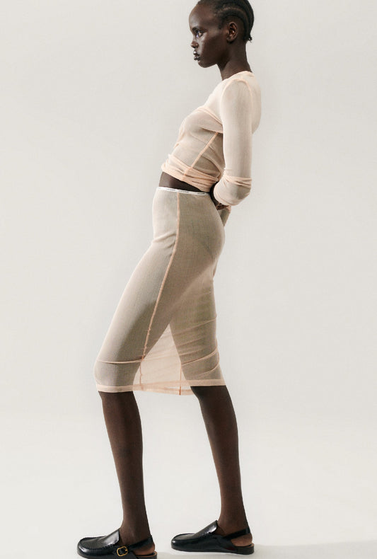 Image of a model wearing Skirts. Product name - Mesh Skirt Daybreak in Daybreak colour by brand - Silk Laundry