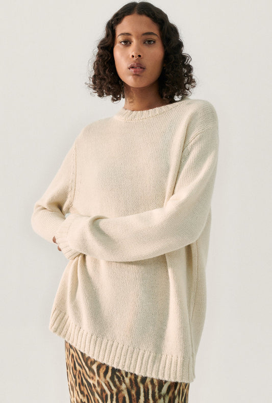 Image of a model wearing Tops. Product name - Knit Crewneck Natural in Natural colour by brand - Silk Laundry
