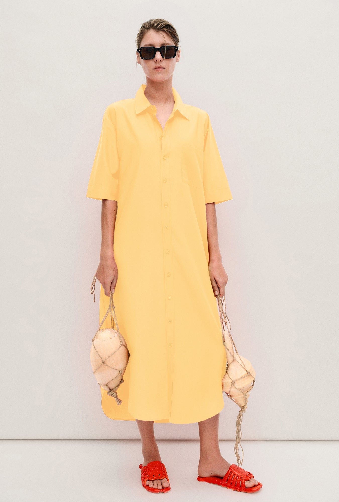Image of a model wearing Tops. Product name - Short Sleeve Boyfriend Shirt Dress Margarita in Margarita colour by brand - Silk Laundry