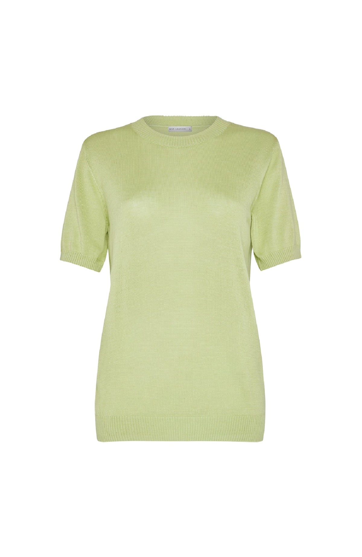Image of a model wearing Outerwear. Product name - Short Sleeved Sweater Luminary in Luminary colour by brand - Silk Laundry