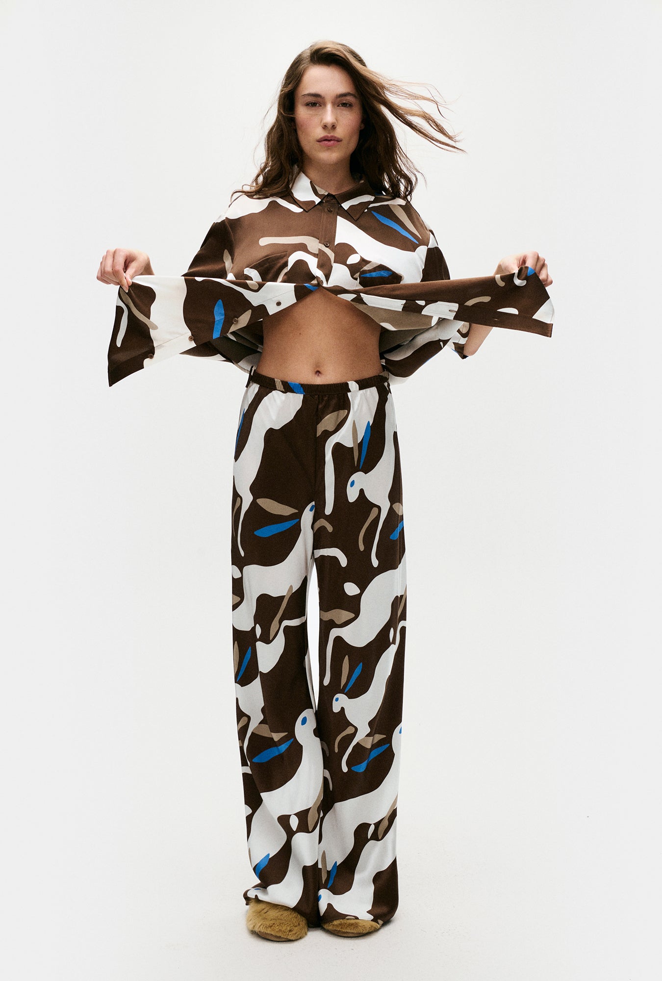 Image of a model wearing Pants. Product name - Bias Cut Pants Rabbit Dark Earth in Rabbit Dark Earth colour by brand - Silk Laundry