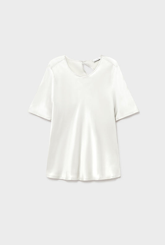 Image of a model wearing Tops. Product name - Short Sleeve Bias Top White in White colour by brand - Silk Laundry